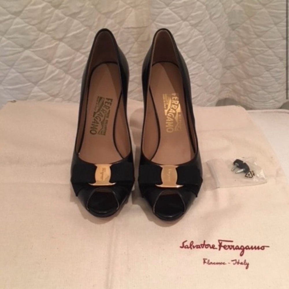 New never worn Ferragamo peep toe pumps.